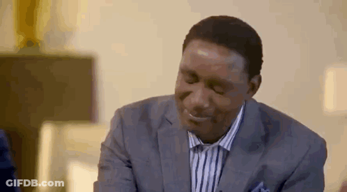 Man In Suit Smiling Looking Down GIF