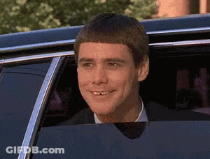 Man In Suit Smiling Out Car Window GIF