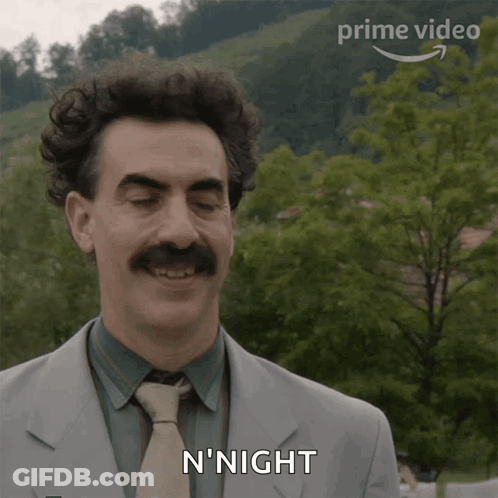 Man In Suit Smiling Saying N'Night GIF