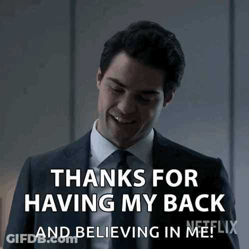 Man In Suit Smiling Saying Thanks For Having My Back GIF