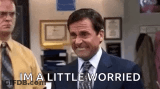 Man In Suit Smiling Says Im A Little Worried GIF