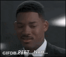 Man In Suit Smiling Says Pfft ... Nah GIF
