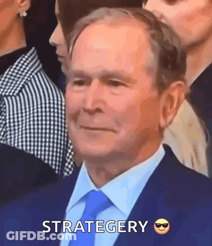 Man In Suit Smiling Strategy GIF