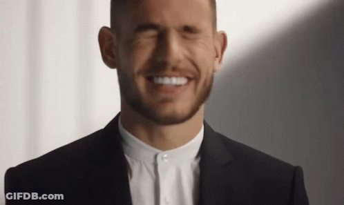 Man In Suit Smiling With Eyes Closed GIF