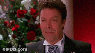 Man In Suit Smiling With Eyes Closed GIF