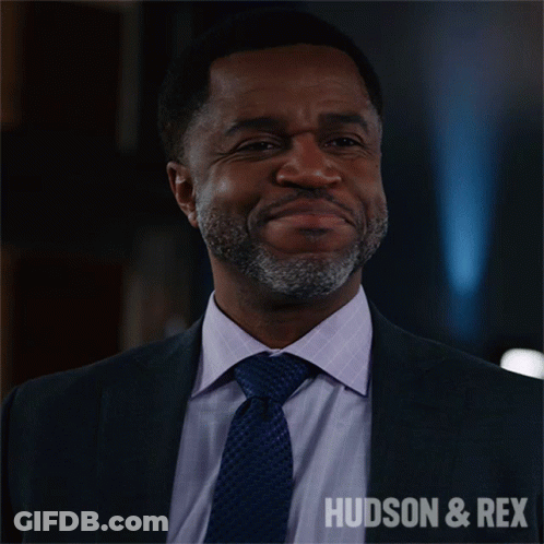 Man In Suit Smiling With Hudson & Rex GIF