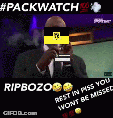 Man In Suit Smoking Behind Yellow Flag GIF