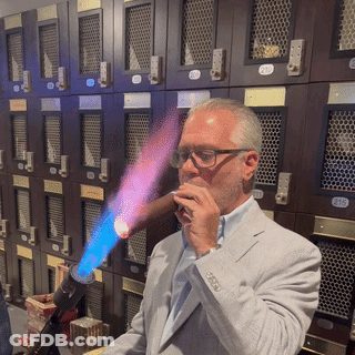 Man In Suit Smoking Cigar By Lockers 213 GIF