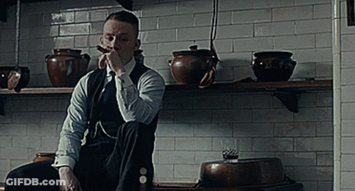 Man In Suit Smoking Cigar In Kitchen GIF