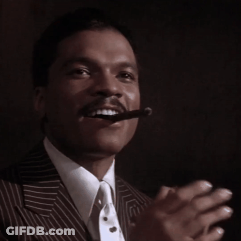 Man In Suit Smoking Cigar GIF