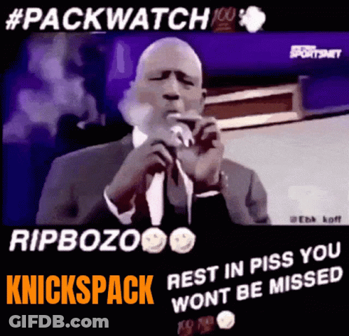 Man In Suit Smoking Cigarette At Microphone GIF