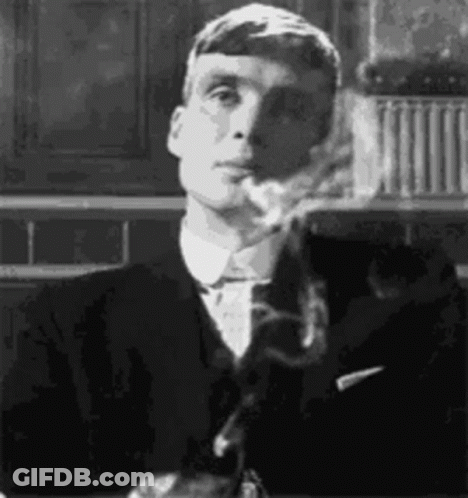 Man In Suit Smoking Cigarette Black And White GIF
