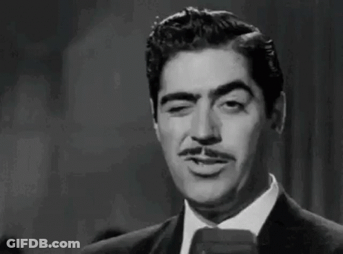Man In Suit Smoking Cigarette GIF