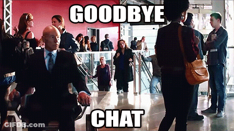 Man In Suit Smoking Cigarette In Front Of EOI Sign GIF