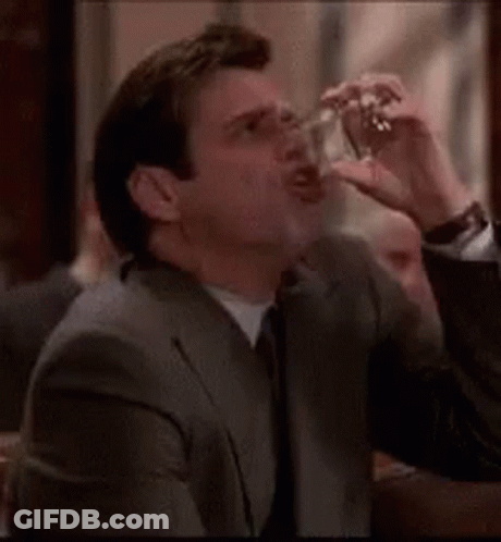 Man In Suit Smoking Cigarette GIF