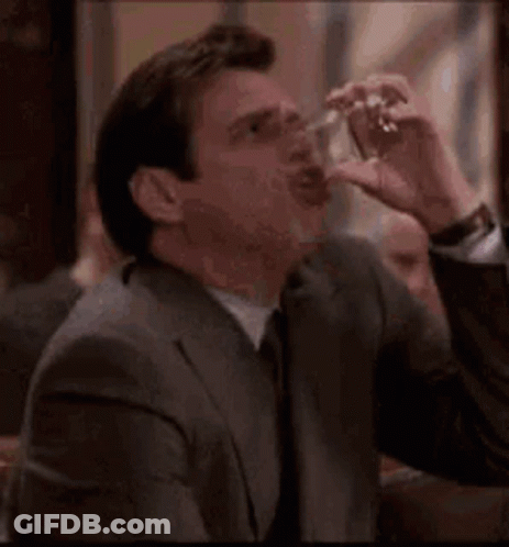 Man In Suit Smoking Cigarette GIF
