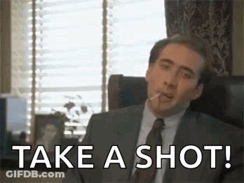 Man In Suit Smoking Says Take A Shot GIF