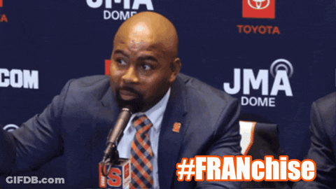 Man In Suit Speaking At JMA Dome GIF