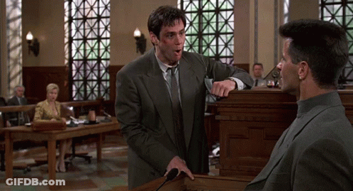 Man In Suit Speaking At Podium GIF