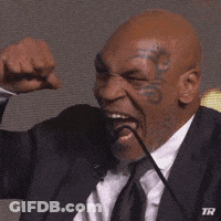 Man In Suit Speaking Into Microphone GIF