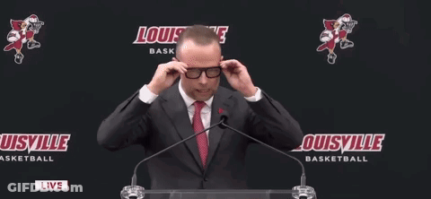 Man In Suit Speaking Into Microphone GIF