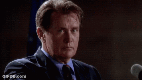Man In Suit Speaking Into Microphone GIF