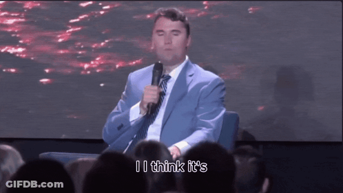 Man In Suit Speaking Into Microphone GIF