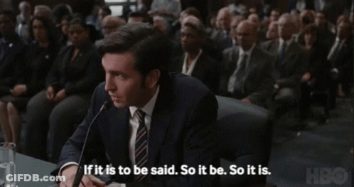 Man In Suit Speaking Into Microphone If It Is To Be Said So It Be So It Is GIF