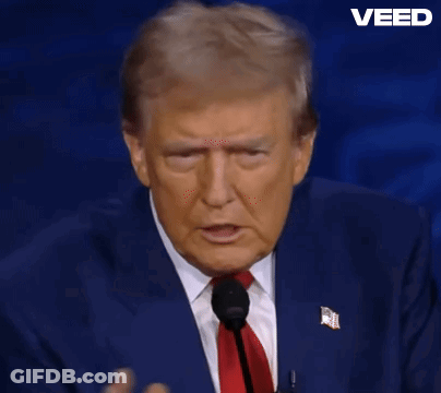 Man In Suit Speaking Into Microphone GIF