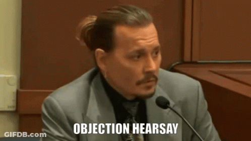 Man In Suit Speaking Into Microphone Objection Hearsay GIF