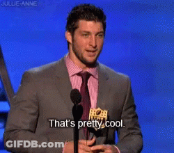 Man In Suit Speaking Into Microphone Saying That's Pretty Cool GIF