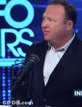 Man In Suit Speaking Microphone At Fox Screen GIF
