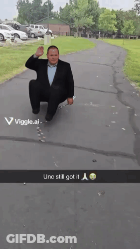 Man In Suit Squatting Unc Still Got It GIF