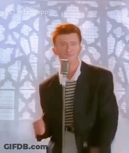 Man In Suit Standing At Microphone GIF