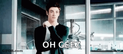 Man In Suit Standing At Window Saying Oh Geez GIF