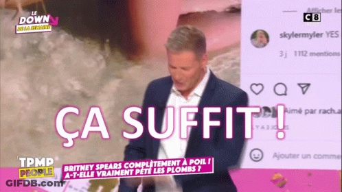 Man In Suit Standing Before Ca Suffit Screen GIF