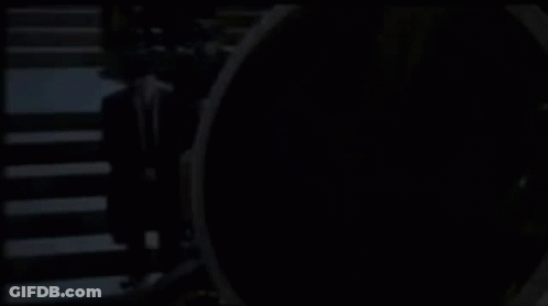 Man In Suit Standing Before CS GO Sign GIF