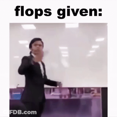 Man In Suit Standing Before Flops Given GIF