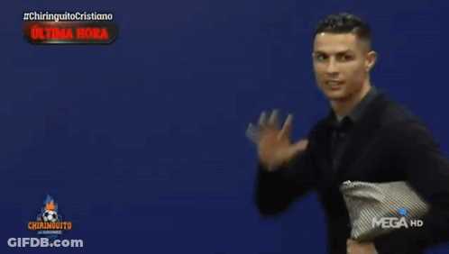 Man In Suit Standing Before Mega HD Sign GIF
