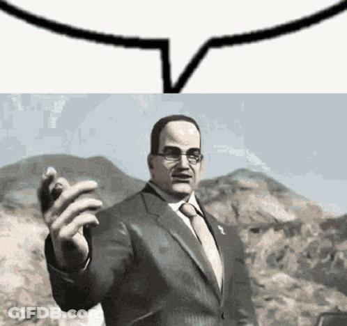 Man In Suit Standing Before Mountain With Speech Bubble GIF