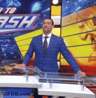 Man In Suit Standing Before Ready To Ash Sign GIF
