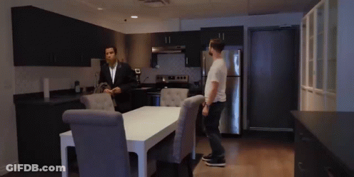Man In Suit Standing Beside Man In White Shirt GIF