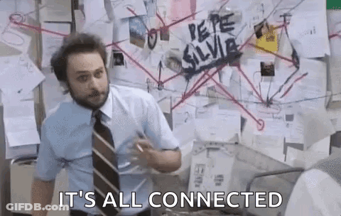 Man In Suit Standing By Bulletin Board GIF