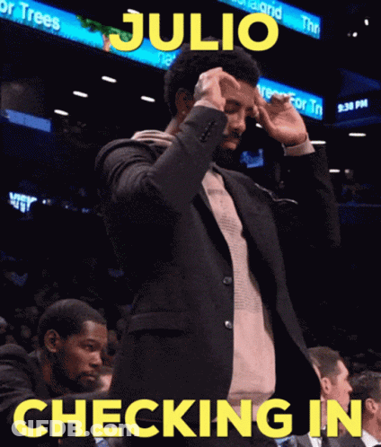Man In Suit Standing By Checking In Sign GIF
