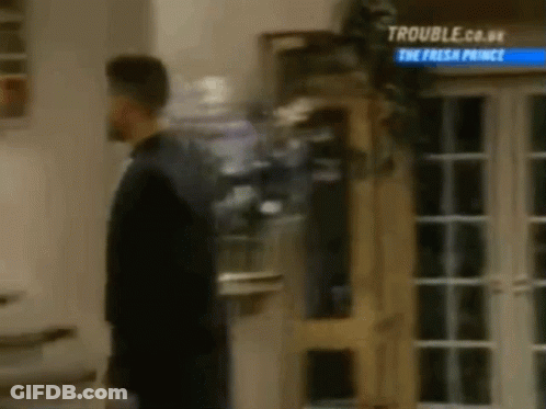 Man In Suit Standing By Door GIF