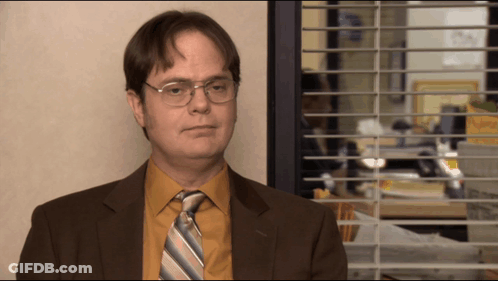 Man In Suit Standing By Window GIF