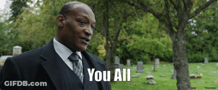 Man In Suit Standing In Cemetery Saying You All GIF