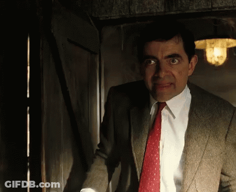 Man In Suit Standing In Doorway GIF