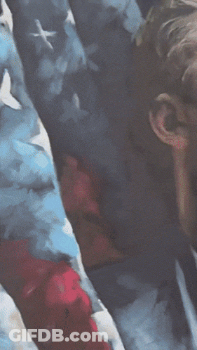 Man In Suit Standing In Front Of American Flag GIF