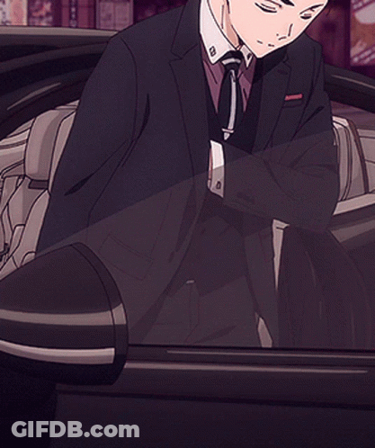Man In Suit Standing In Front Of Aoyama Building GIF